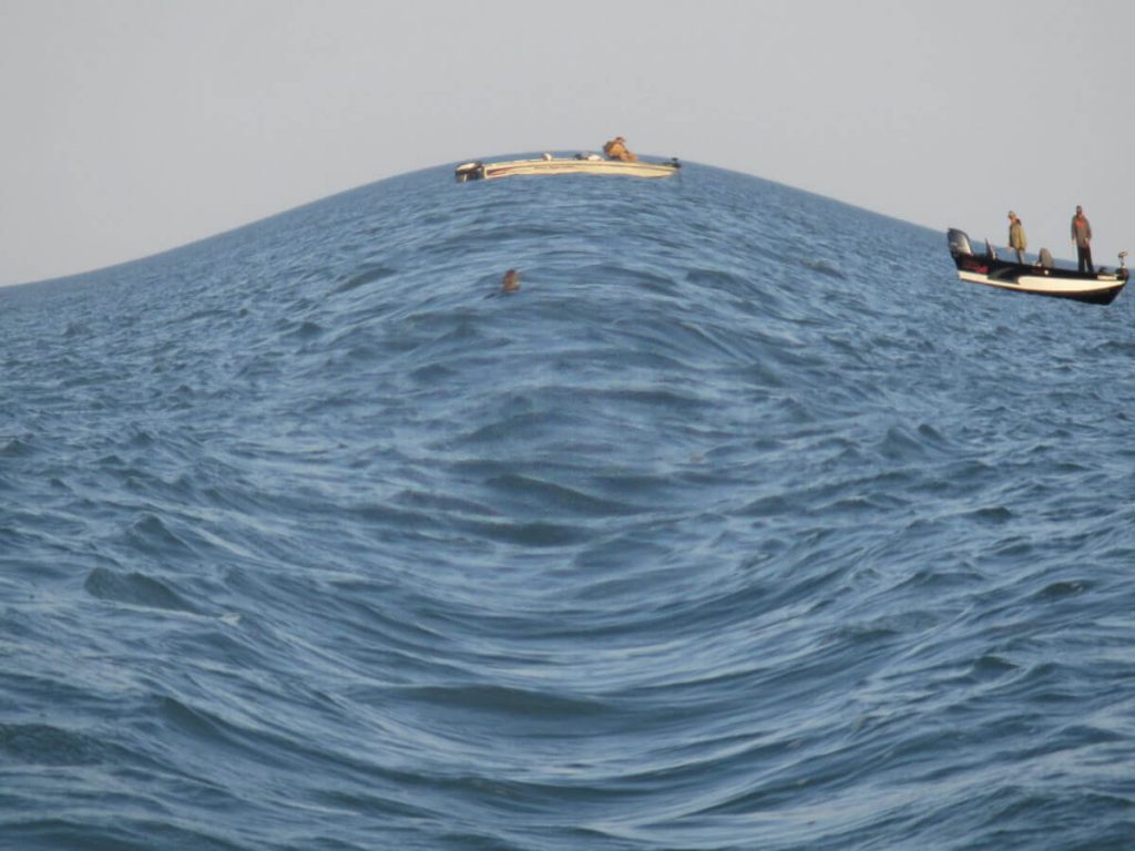 A photograph of the ocean with a fish-eye filter.