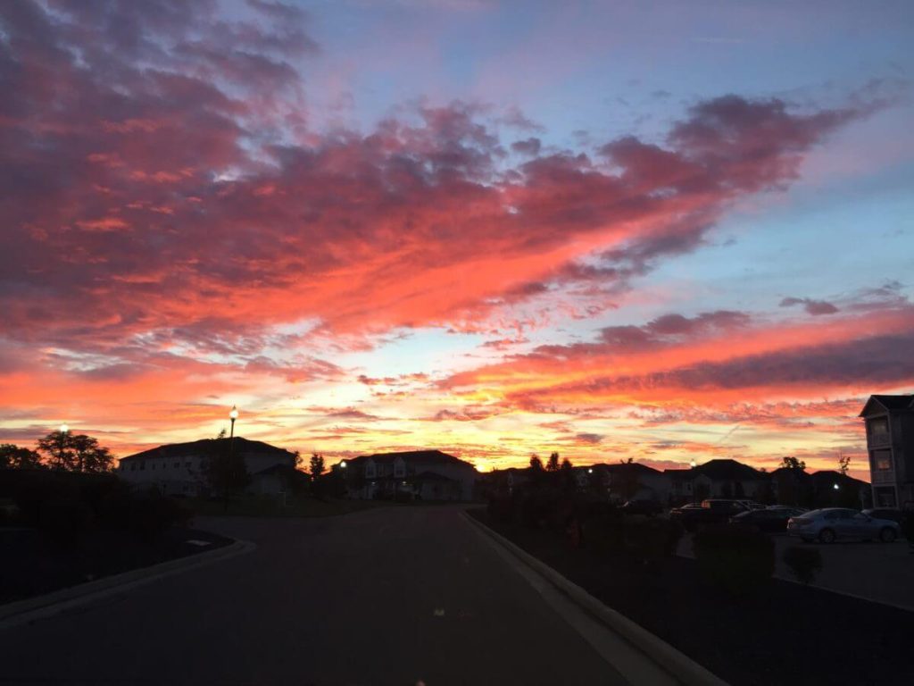 The rosy color of dawn spreads all over the sky