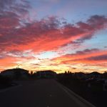 The rosy color of dawn spreads all over the sky