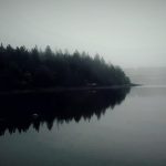 A photograph of an island in the mist.