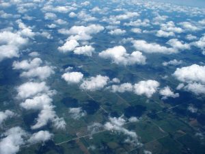 An aerial photograph of clouds over a landscape.