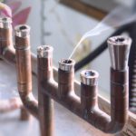 A photograph of smoke coming out of a menorah.