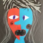 An abstract, Picasso-style collage of a woman’s face.