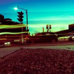 A photograph of a city street at night with blurry lines of light.